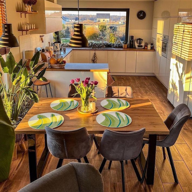 green round glass bead table mat on the dining table