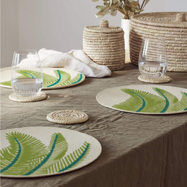 green round glass bead table mat on the table