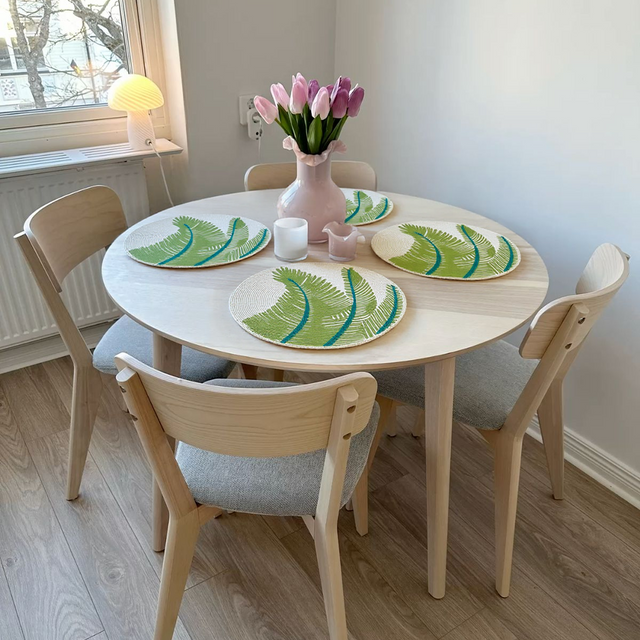 green round glass bead table mat on the table