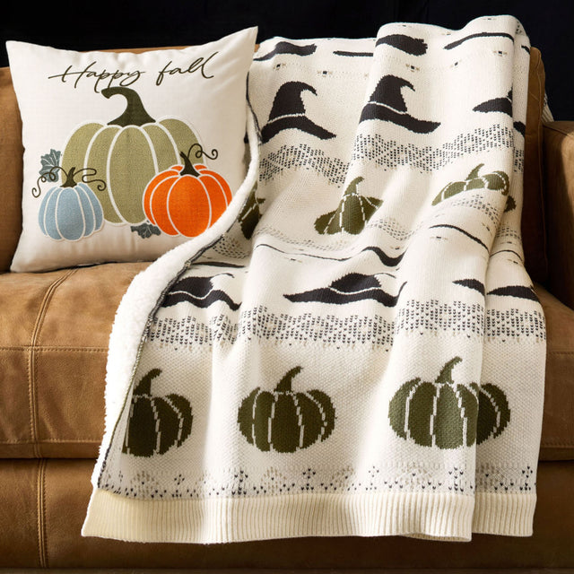 halloween hand-embroidered pumpkin pillowcase on sofa