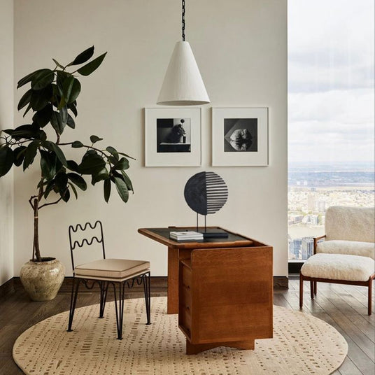 handcrafted wooden fan shaped decorative ornament on the table