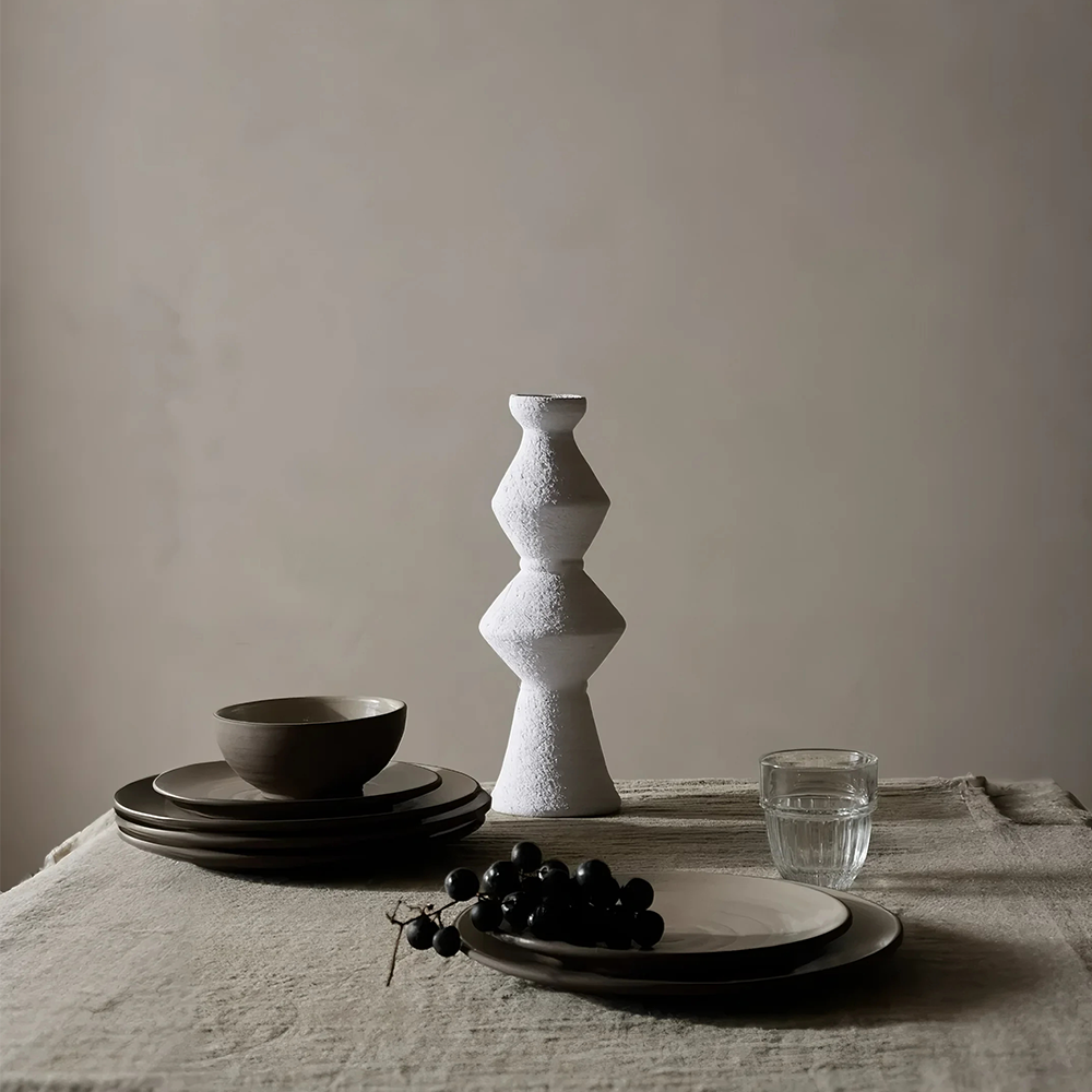 handmade vintage ceramic candle holder on the dining table