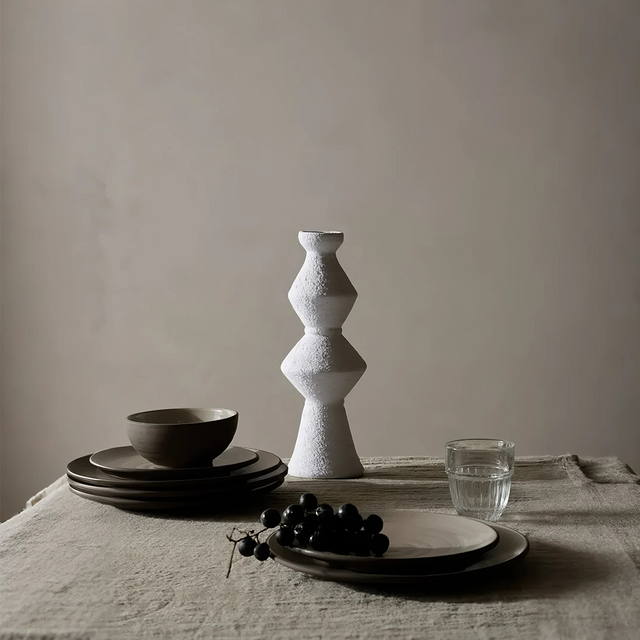 handmade vintage ceramic candle holder on the dining table