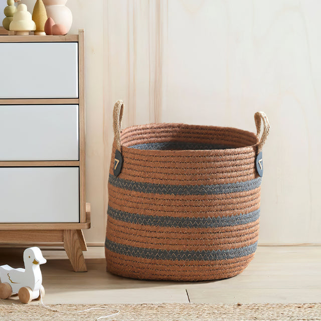 handwoven banana rope storage basket on the floor