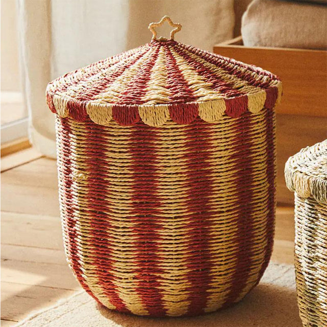 handwoven paper rope storage basket with lid on the floor