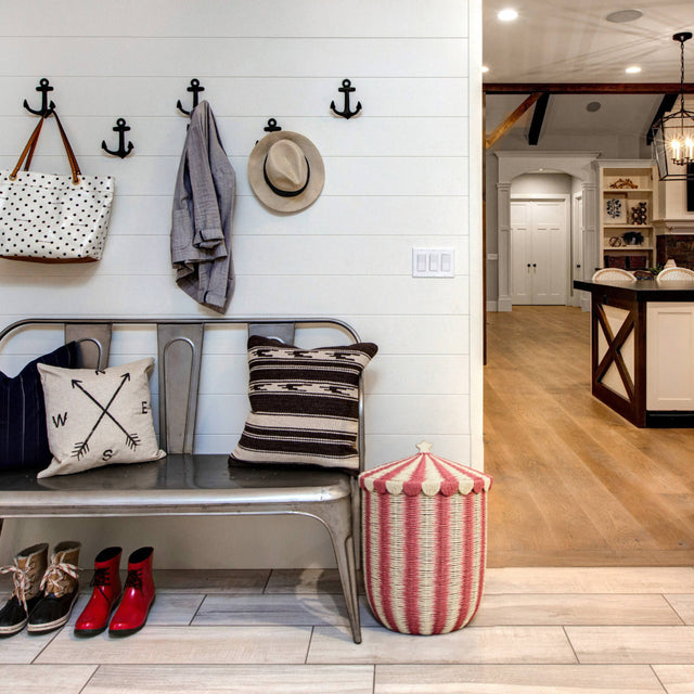 handwoven paper rope storage basket with lid on the floor
