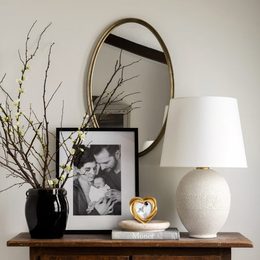 heart-shaped golden decorative picture frame on the table