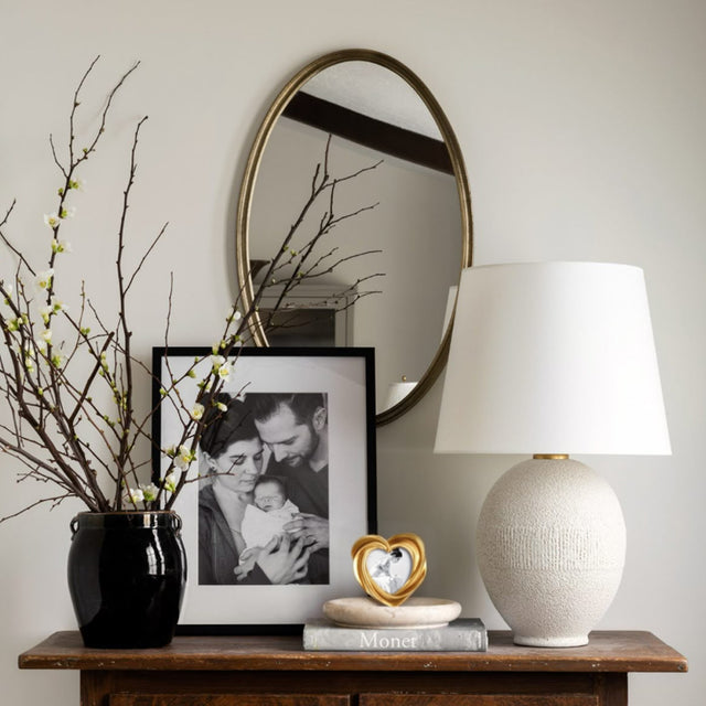 heart-shaped golden decorative picture frame on the table