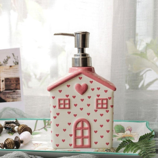 house-shaped pink ceramic soap dispenser details