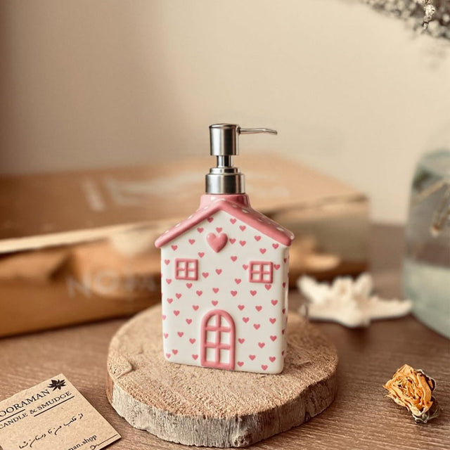 house-shaped pink ceramic soap dispenser details