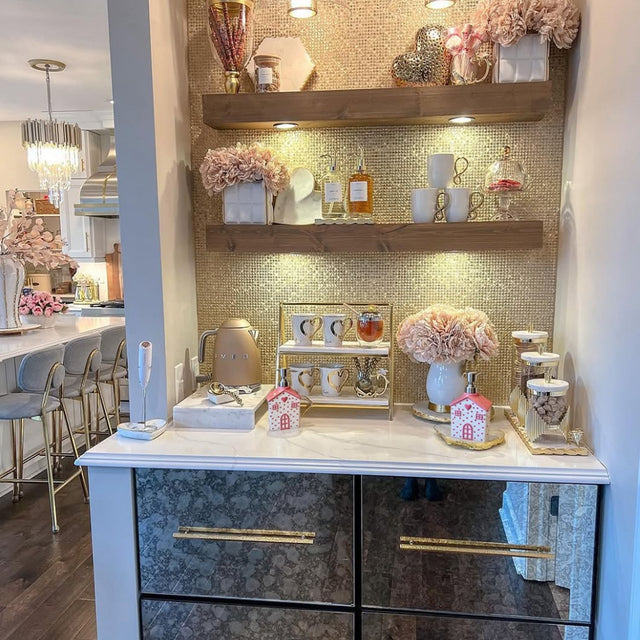 house-shaped pink ceramic soap dispenser on the display area