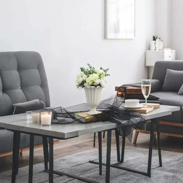 iron vase filled with flowers on the table 3