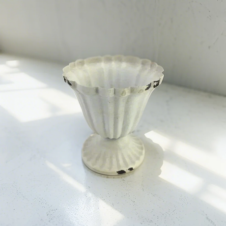 iron vase on the floor