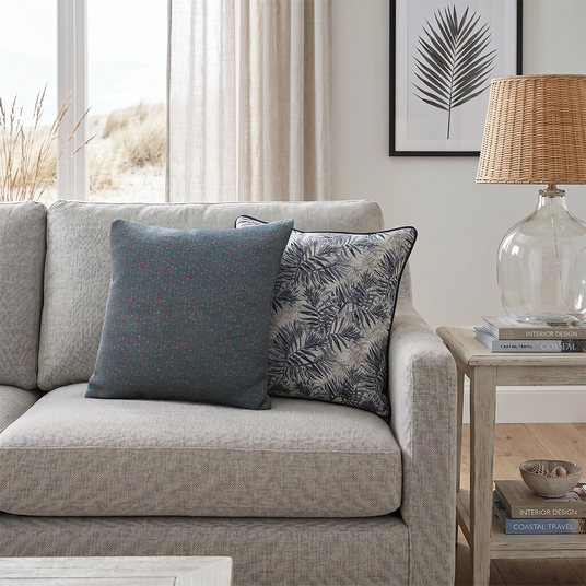 jacquard pillows on sofa with coastal lamp