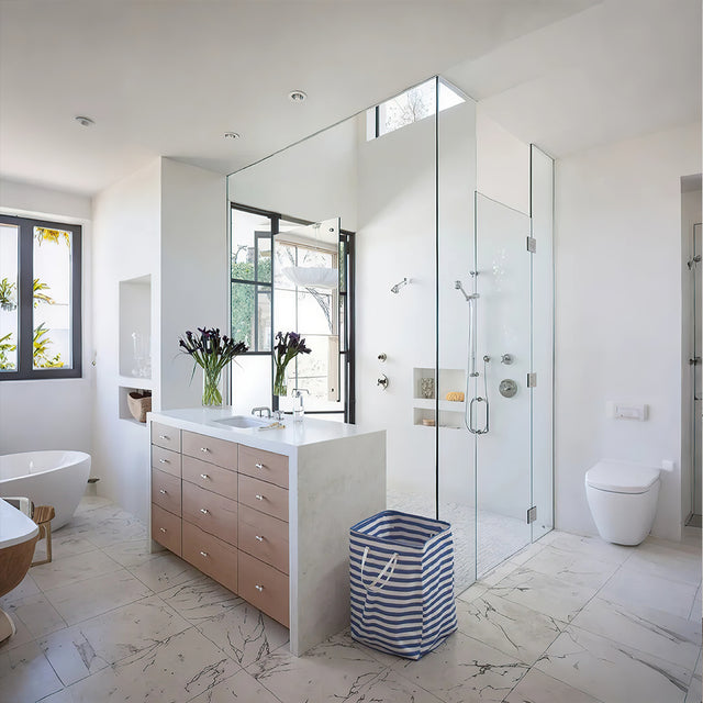 large foldable laundry basket with easy carry handles in the bathroom