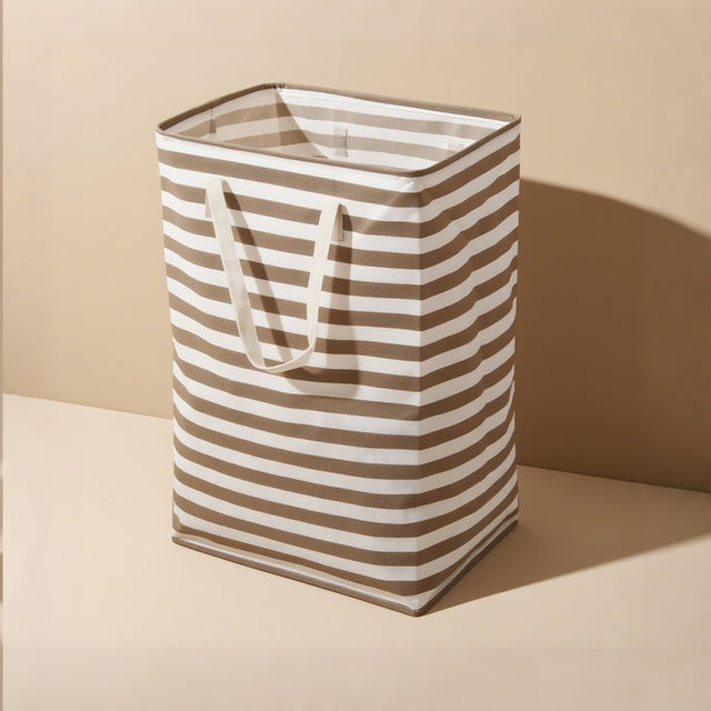 large gray foldable laundry basket with easy carry handles