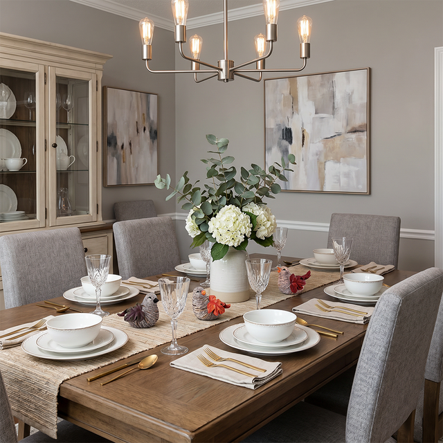 leaf bird sculptures on dining table with place settings