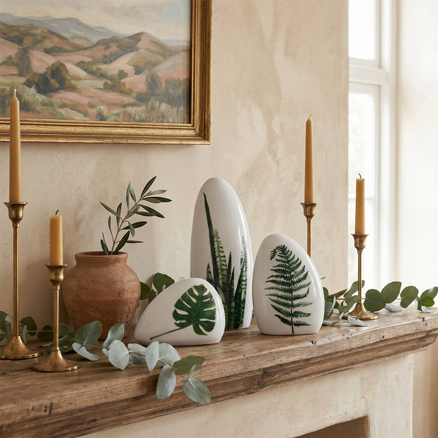 leaf print ceramics on rustic mantel with candles
