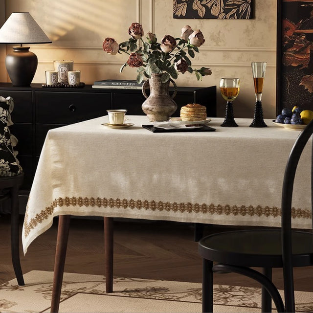 linen plain khaki tablecloth with lace trimming in the dining room