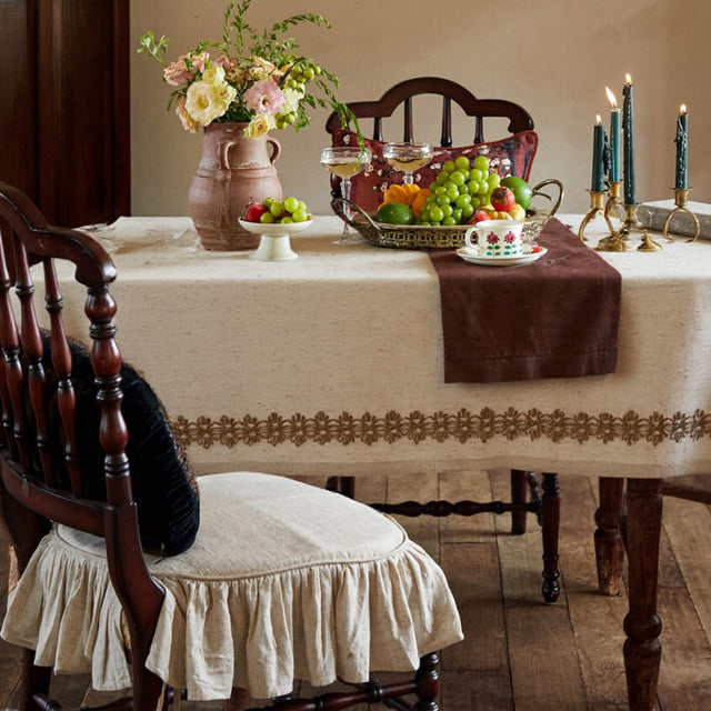 linen plain khaki tablecloth with lace trimming on the table