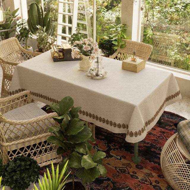 linen plain khaki tablecloth with lace trimming on the table