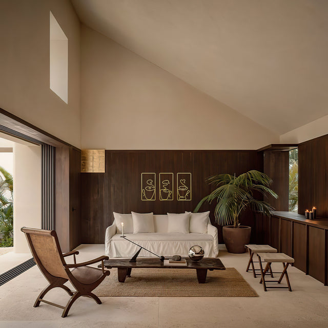 metal coffee mug wall decor on brown wall