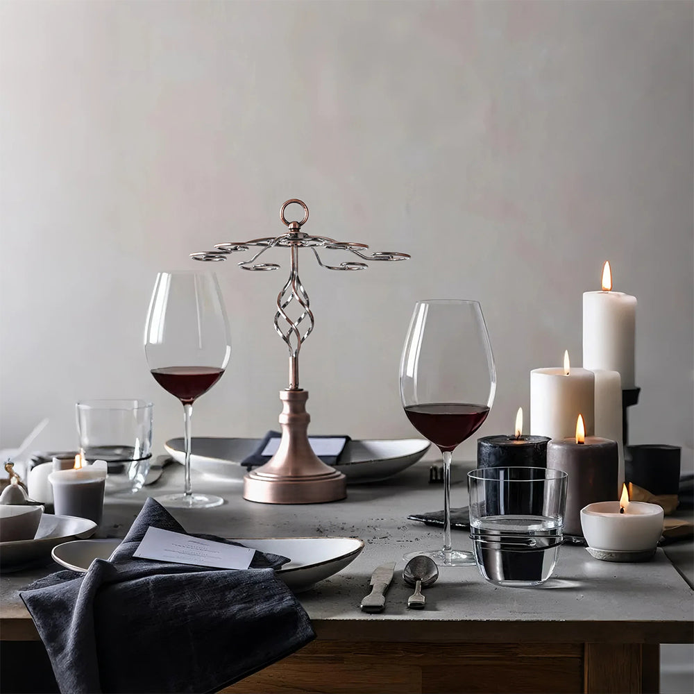 metal hanging wine glass rack on dining table