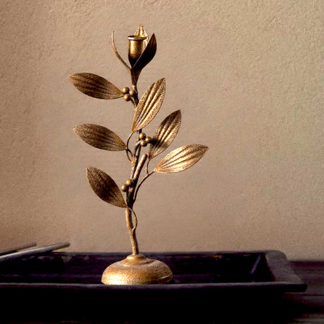 metal leaf candle holder on the table