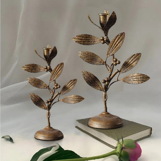 metal leaf candle holder on the table