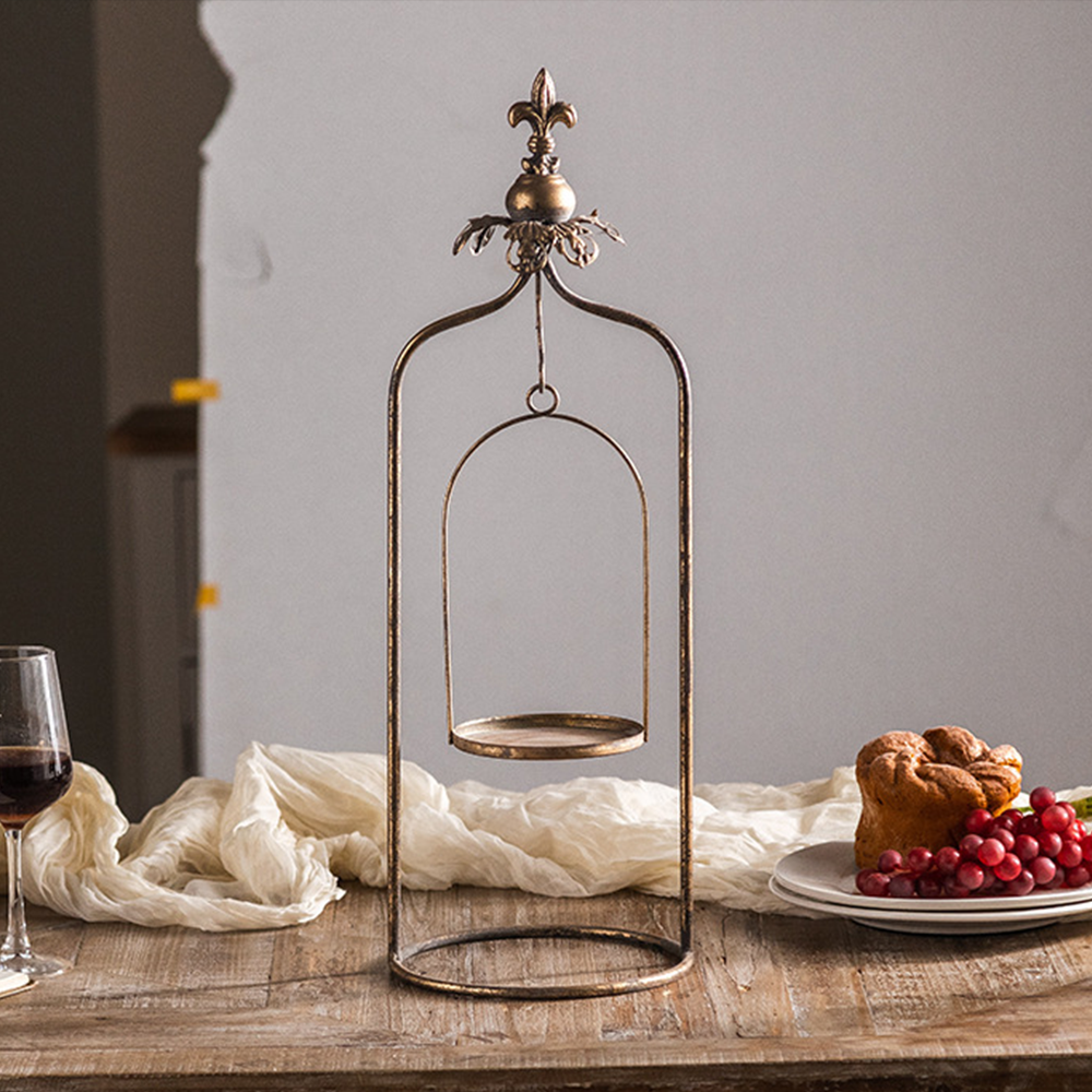 metal pillar candle holder on the table