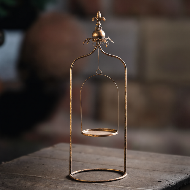 metal pillar candle holder on the table