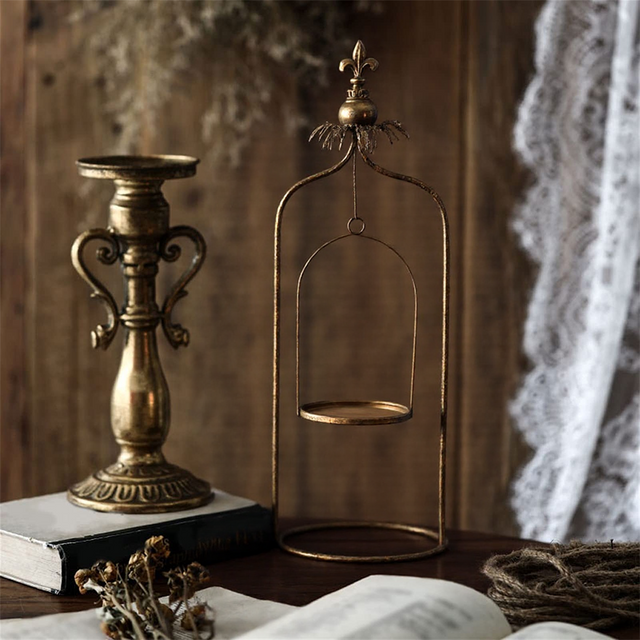 metal pillar candle holder on the table