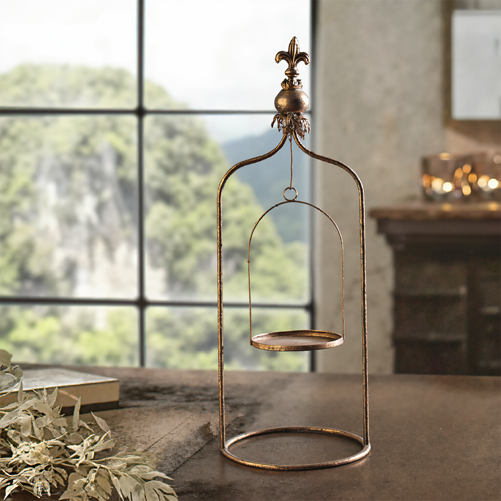 metal pillar candle holder on the table