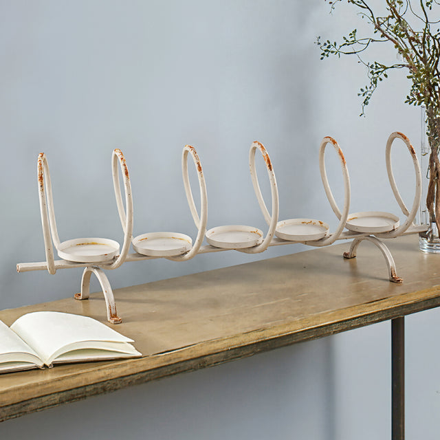 metal ring candelabra on a table