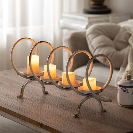 metal ring candelabra on a wooden table
