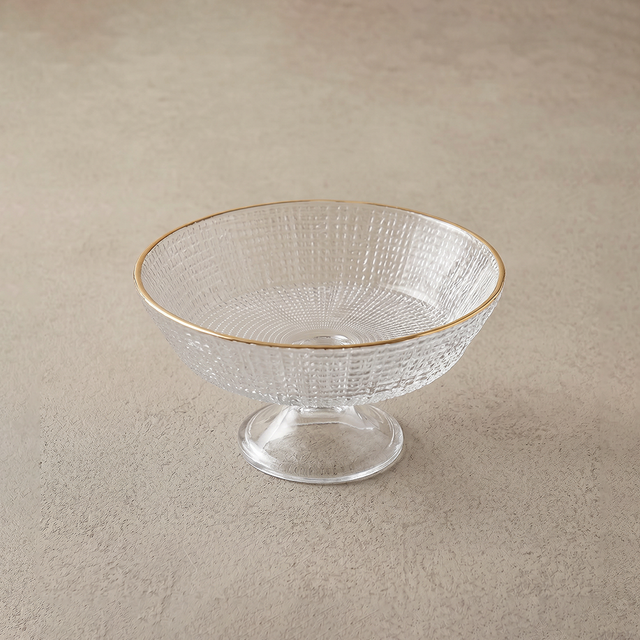 middle glass bowl on beige surface