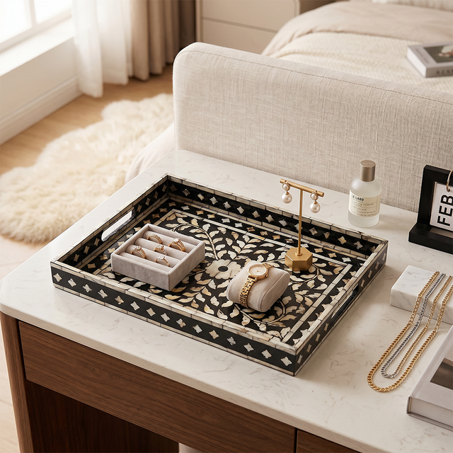 mosaic tray with jewelry on bedside table