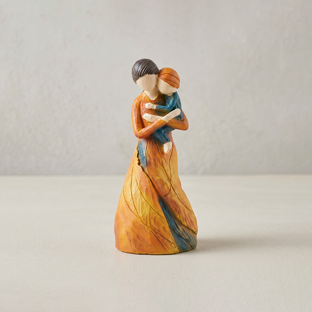 mother child figurine on white background