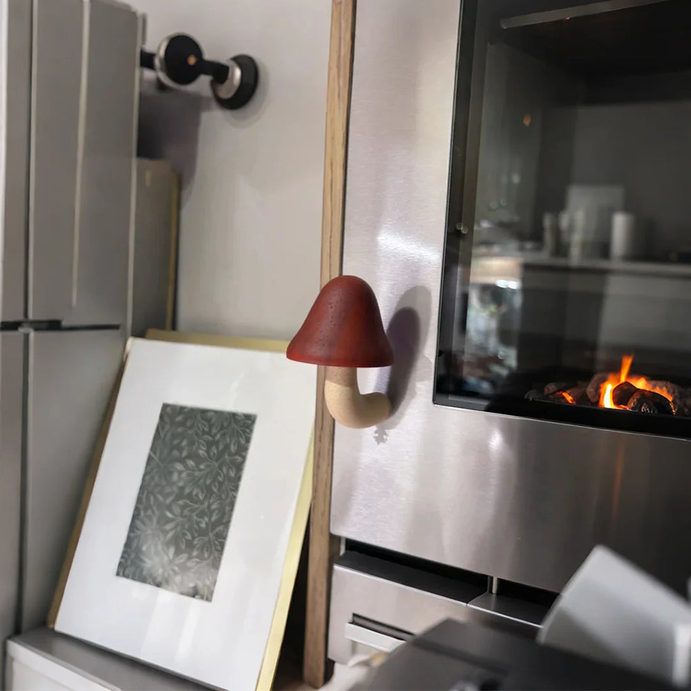 mushroom refrigerator magnet stuck on the wall