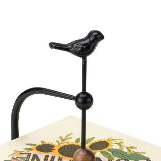 napkin-holder-with-bird-figurine-decor-close-up-05301