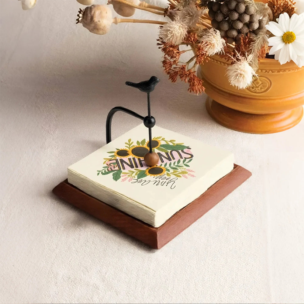 napkin-holder-with-bird-figurine-decor-close-up-05302