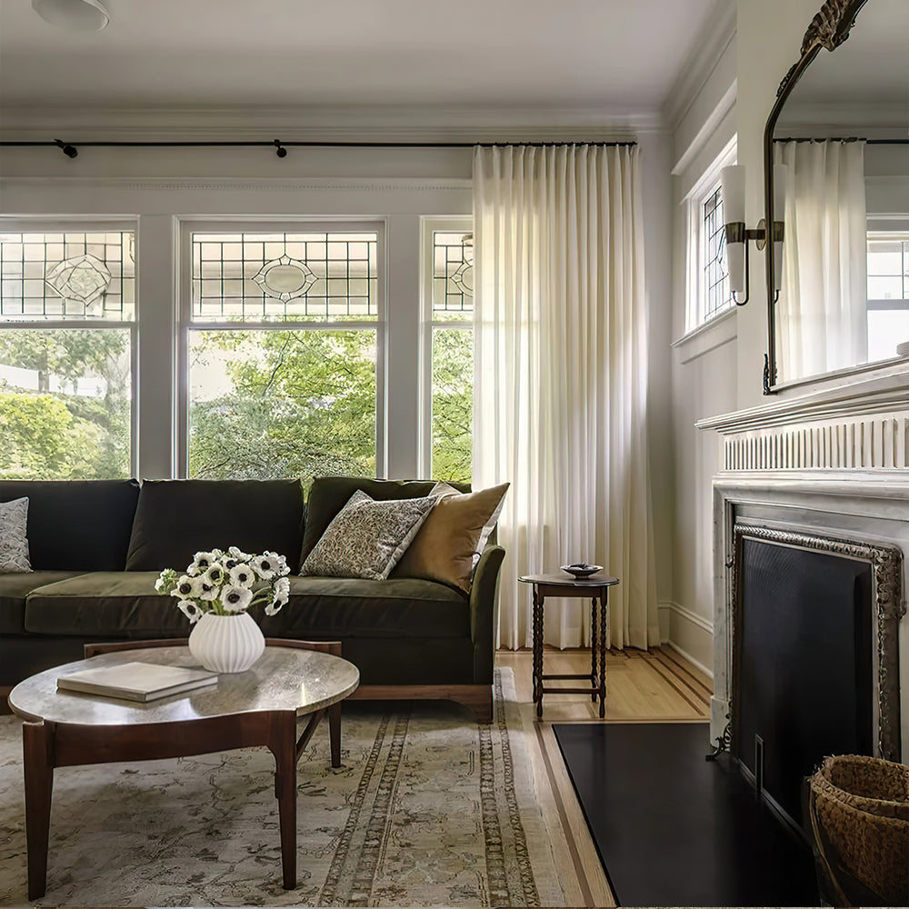 off white ceramic flower vase on the table in the living room