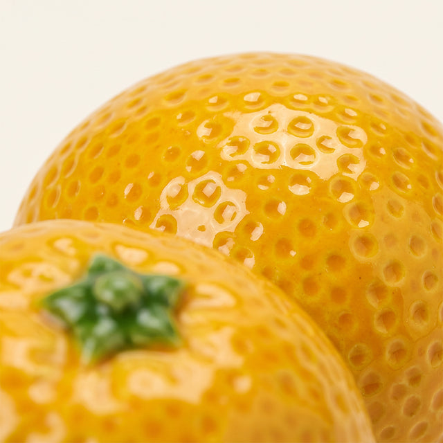 orange candle holder macro pitted skin