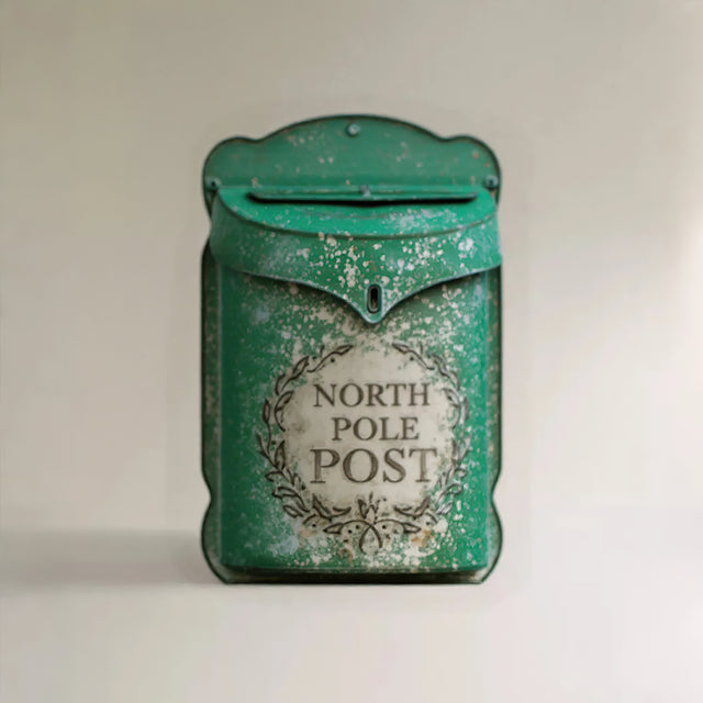 outside rustic green iron wall mailbox