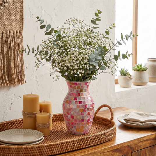pink mosaic vase with babys breath on tray