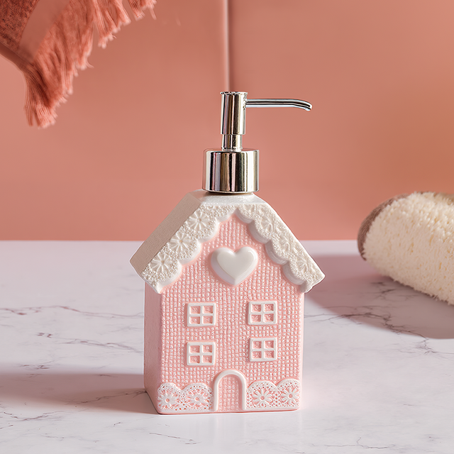 pink soap dispenser on the table
