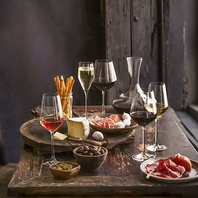 premium goblet glass filled with wine on the table