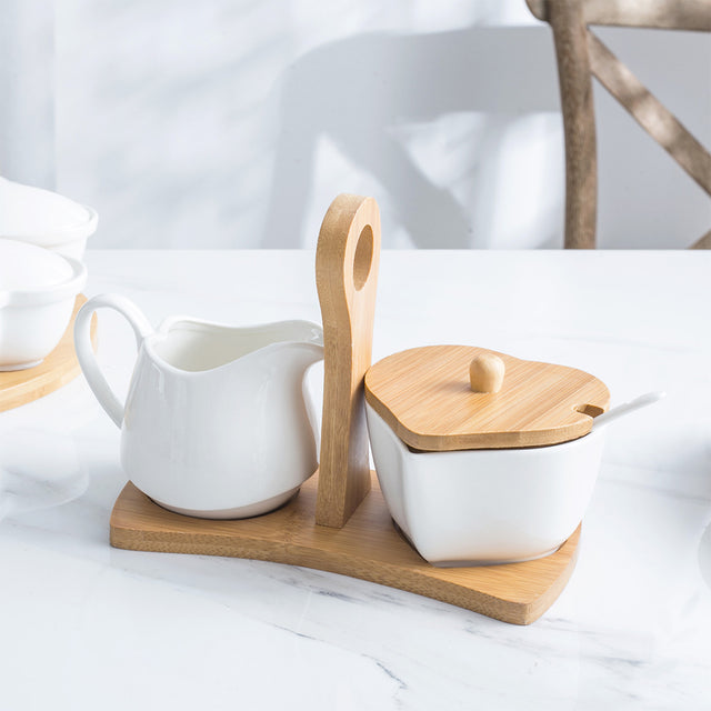 pure white ceramic sugar jar and creamer set on the table