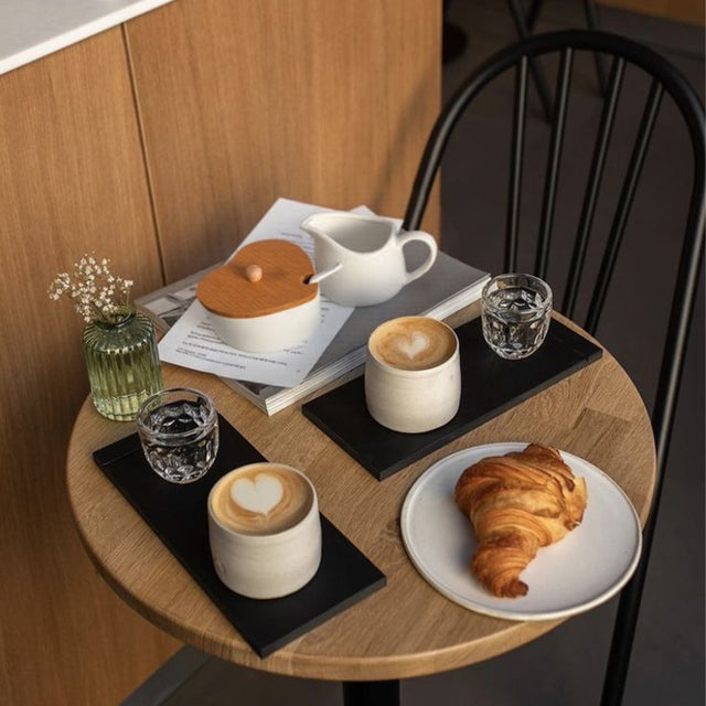 pure white ceramic sugar jar and creamer set on the table