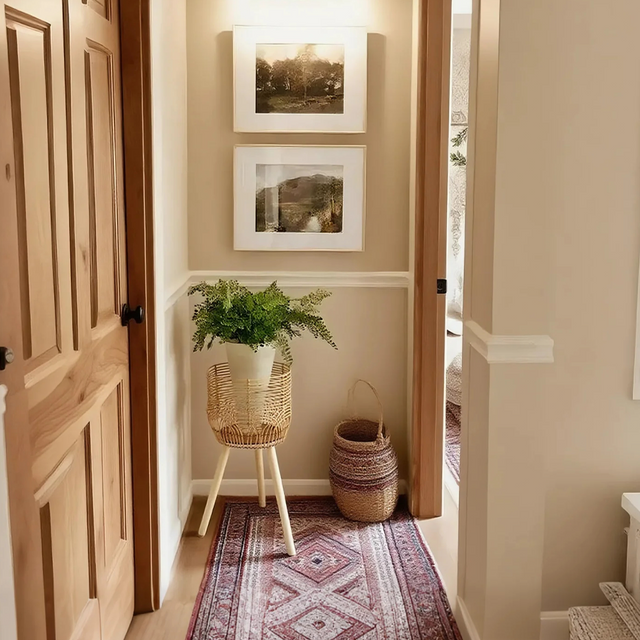 rattan plant stand in hallway